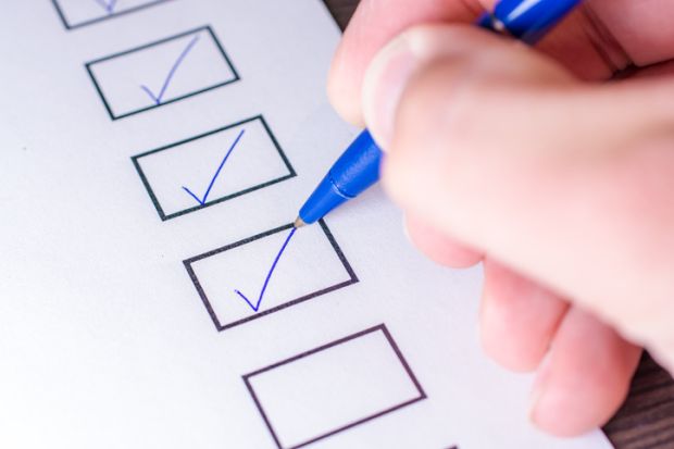 A person ticking boxes