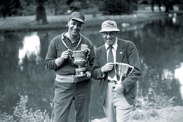 Two men with trophies