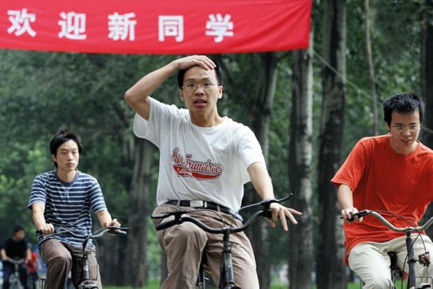 Tsinghua University students riding bicycles on campus Tsinghua University students riding bicycles on campus