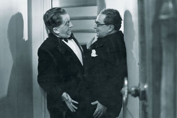 Two men stuck in doorway Two men stuck in doorway