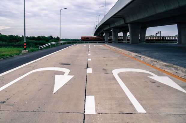 U-turn road markings under elevated carriageway U-turn road markings under elevated carriageway