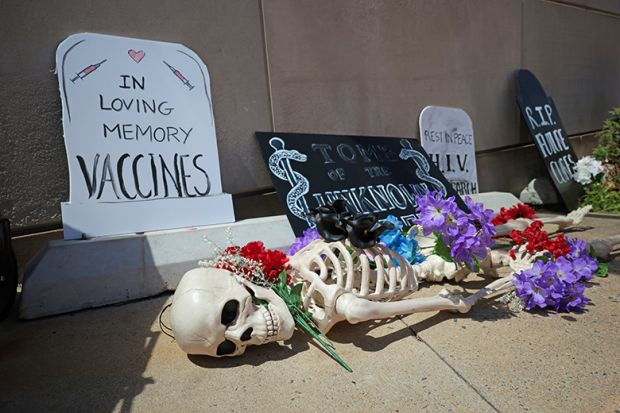 A memorial for the loss of funding for research and public health programs is placed in front of the National Institutes of Health (NIH), 10 May, 2025 in Bethesda, Maryland. A protest against Robert F. Kennedy, Jr.'s "Make America Healthy Again" movement.