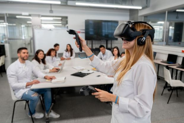 A student uses virtual reality headset in the classroom