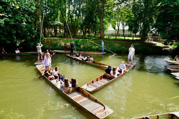 Punts on River Cherwell, Oxford Visitor punting on river Cherwell in Oxford
