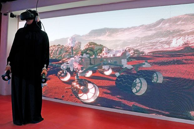 Muslim woman wears VR headset