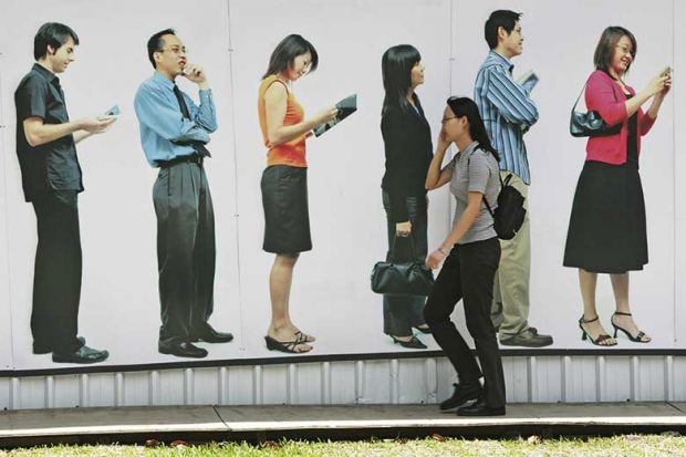walking-past-queue-on-phone walking-past-queue-on-phone