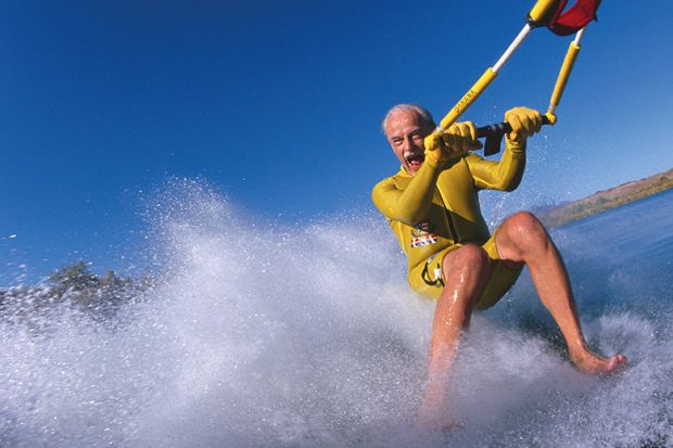 Older man waterskis Older man waterskis