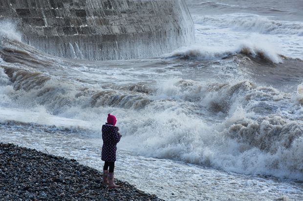 Waves breaking over the Cobb at Lyme Regis, Dorset, England Waves breaking over the Cobb at Lyme Regis, Dorset, England