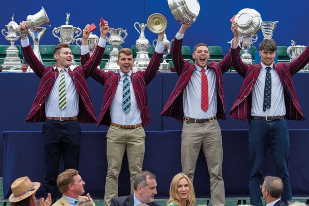 Line of winners holding up their trophies to illustrate Oxford Covid vaccine windfall outweighs rest of sector IP income