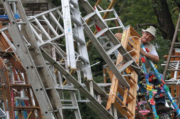 Artist Charlie Brouwer adds another ladder to his creation as a project grows past 200 ladders Artist Charlie Brouwer adds another ladder to his creation as a project grows past 200 ladders to illustrate One in five UK professors promoted for their teaching – survey