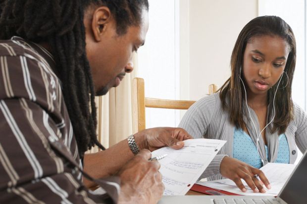 Father and daughter studying to illustrate College: enrol with us and your family and friends can come, too