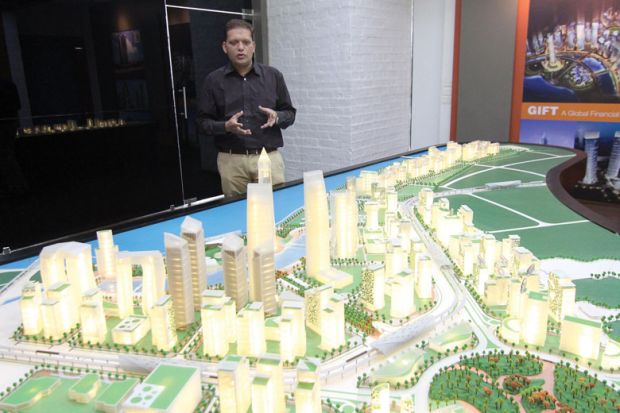 Dipesh Shah, Vice President of GIFT shows a model of GIFT City in Gandhinagar, India Dipesh Shah, Vice President of GIFT shows a model of GIFT City in Gandhinagar, India to illustrate India’s regulation-free city offers blueprint for branch campuses