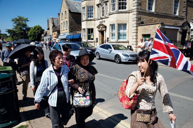 Chinese tourists take a guided tour at Bourton-on-the-Water UK Chinese tourists take a guided tour at Bourton-on-the-Water UK to illustrate Chinese students ‘prefer UK to other study destinations’