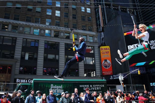 Two people ride a zipline in New York City to illustrate US lawmakers encouraging three-year degree experiments