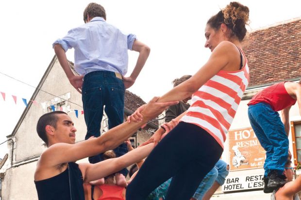Street performers practice their routine to illustrate French research reforms ‘must tackle distrust’ to succeed
