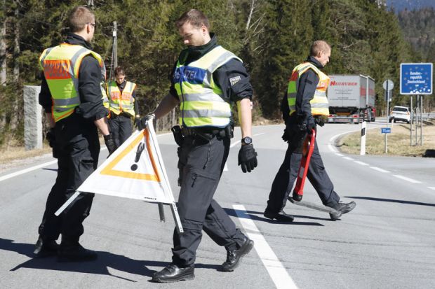 German police guards secure an access road German police guards secure an access road to illustrate Language barrier holds back international academics in Germany