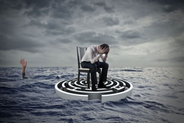 Concept of a person sitting with head in hands on a maze in the sea with a hand raised in the distance Concept of a person sitting with head in hands on a maze in the sea with a hand in the distance raised to illustrate UK, US law must fix clash between privacy rights and protecting lives