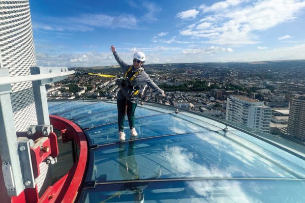 A visitor to British Airways i360 Viewing Tower in Brighton standing on the skywalk A visitor to British Airways i360 Viewing Tower in Brighton standing on the skywalk to illustrate TPS: universities seek respite from £125 million pensions bill