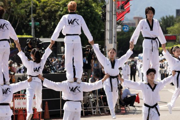 A group of Taiwanese from a martial art organization show their skills A group of youngTaiwanese from a martial art organization show their skills to illustrate Taiwanese ‘merger’ seen as a model for struggling universities