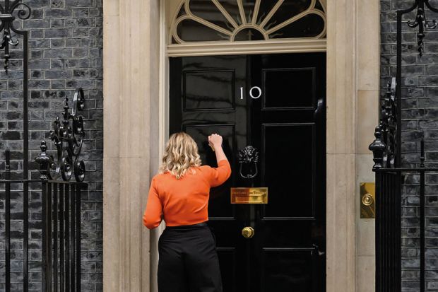 A woman knocks on the door of number 10 A woman knocks on the door of number 10 to illustrate Crisis communications
