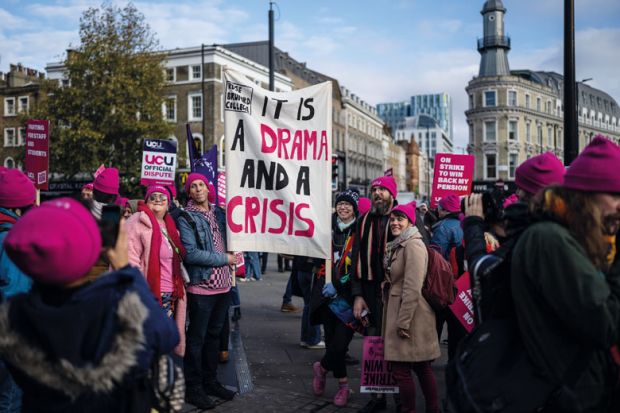 Protesters take part in a union rally  by the University and College Union (UCU) amid strike action by staff to illustrate Eight per cent rise would end strikes, say labour experts