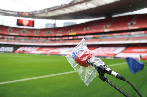  A microphone is covered from the rain pitchside to illustrate University postpones free speech event, over free speech concerns