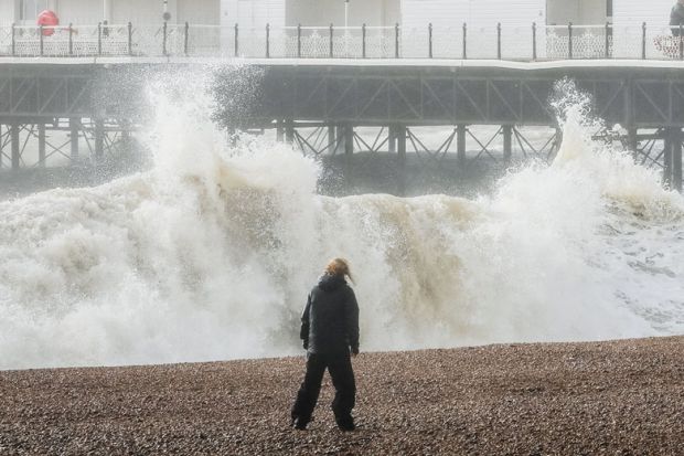  Storm waves break against Brighton Palace Pier to illustrate Bumper rises in postgraduate fees at some UK institutions