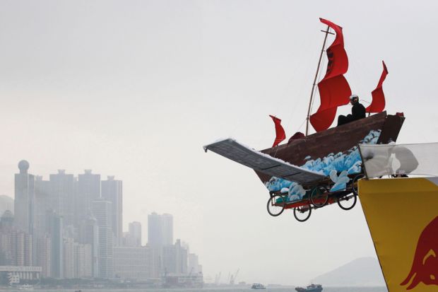 A participant sits in his structure that features a traditional Chinese fishing boat at the Red Bull Flugtag (flight day) competition in Hong Kong A participant sits in his structure that features a traditional Chinese fishing boat at the Red Bull Flugtag (flight day) competition on a cloudy day in Hong Kong to illustrate Opaque investigation fails to clear clouds over HKU council