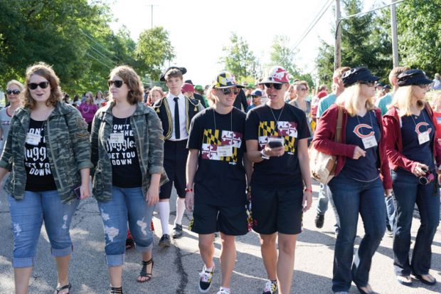 Twins walking together  Twins Day Festival in Twinsburg Ohio to illustrate Will ‘dual enrolment’ surge promote social equity