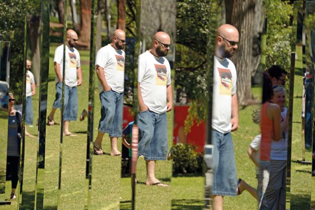 A man is reflected in a number of the mirrors to illustrate Avoid imposing ‘rigid rules’ on self-citations, journals told