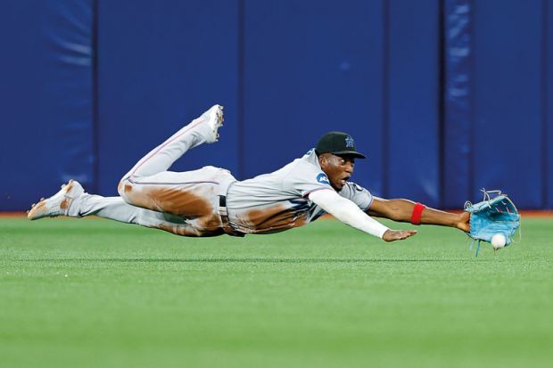 Jesus Sanchez #7 of the Miami Marlins misses a fly ball during a game  to illustrate Sasse puts focus on under-performing academics at Florida