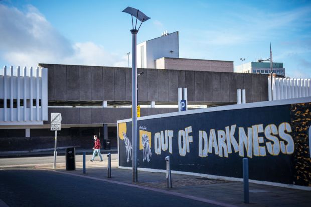 A hoarding surrounds a brownfield site waiting for redevelopment in the Horseley Fields area of Wolverhampton with graffiti reading 'Out of the darkness' A hoarding surrounds a brownfield site waiting for redevelopment in the Horseley Fields area of Wolverhampton with graffiti reading 'Out of the darkness' to illustrate Post-92s ‘inspire and drive social mobility’