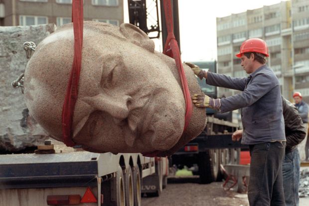 Worker removing the head of a statue representing late Soviet leader Vladimir Ilyich Lenin Worker removing the head of a statue representing late Soviet leader Vladimir Ilyich Lenin to represent Amid war, Russian 101 enrolments plummet at Western institutions