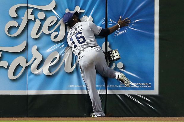 Outfielder Abraham Almonte crashes into the wall in Phoenix, Arizona to illustrate University of Phoenix’s two-year bid for a buyer revealed