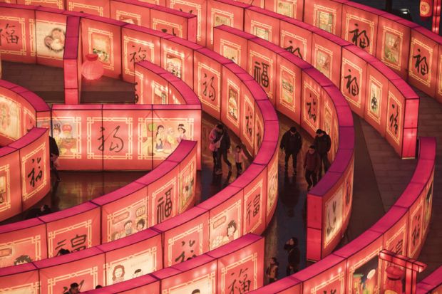 Chinese people walk in a maze at the Tang Paradise Park in Xian Chinese people walk in a maze at the Tang Paradise Park in Xian