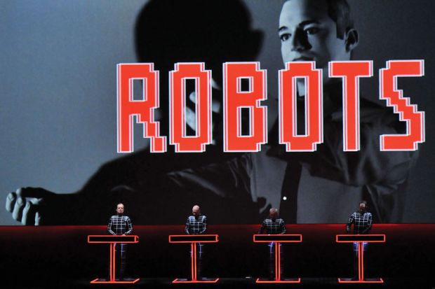 Ralf Hutter, Henning Schmitz, Fritz Hilpert and Falk Grieffenhagen, of German electronic pioneers Kraftwerk, perform live on stage during the first night of their Catalogue retrospective at the Tate Modern Turbine Hall