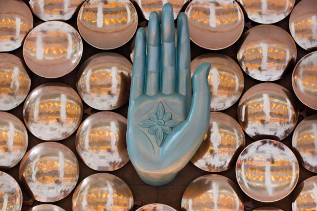 An indian mudra, a finger gesture, at New Delhi Indira Gandhi International Airport to illustrate More foreign academics report being denied entry to India