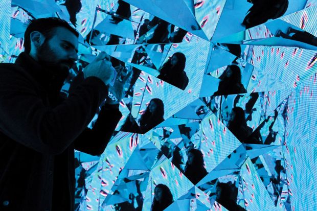 SYDNEY, AUSTRALIA - JUNE 06: A couple taking photos in an installation in the Samsung Galaxy Studio SYDNEY, AUSTRALIA - JUNE 06: A couple taking photos in an installation in the Samsung Galaxy Studio