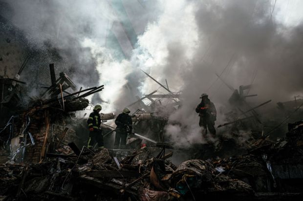 Ukrainian firefighters push out a fire after a strike in Zaporizhzhia   Ukrainian firefighters push out a fire after a strike in Zaporizhzhia  to illustrate Pseudo science has fuelled the bloodshed in Ukraine