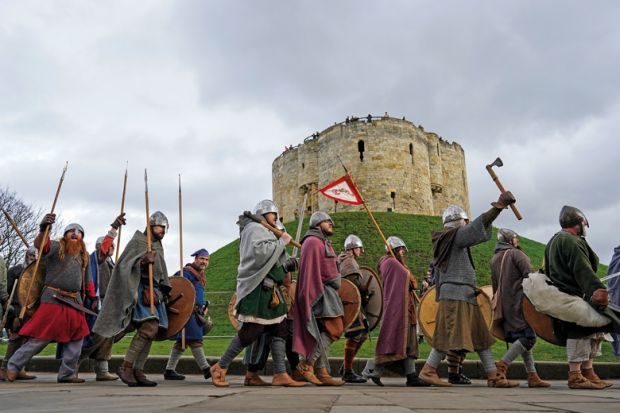 Viking re-enactors march through York to illustrate UK recruitment woes spur new bout of cuts 