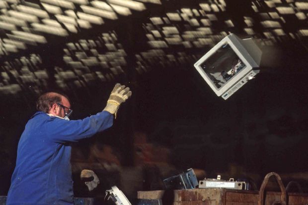  Scrap yard of computers for salvage of gold from integrated circuits.to illustrate Slash wasteful IT spend and invest in academics instead – expert