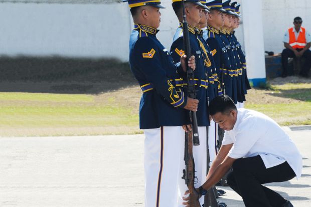 A presidential guard inspects members of the honor guard A presidential guard inspects members of the honor guard to illustrate hilippines military training for students ‘aims at stifling dissent’