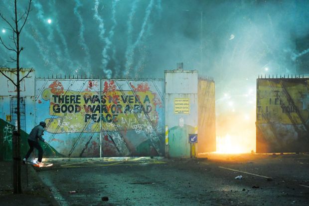 Nationalists and Loyalists riot against one another at the Peace Wall interface gates  to illustrate Academics back creation of pan-Irish higher education area