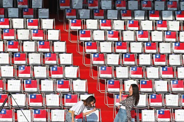 Two people in front of empty seating in Taiwan Two people in front of empty seating in Taiwan to illustrate Scholars doubtful of Taiwan’s international student target