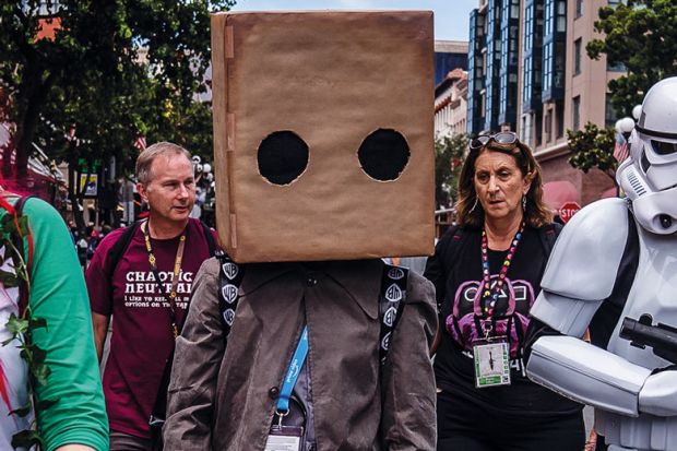 Person dressed with a large cardboard box covering his head to illustrate 2U’s edtech ethics submission criticised