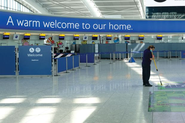 A cleaner at work in an empty Terminal 5 at Heathrow Airport to illustrate Fewer early career researchers heading to UK from European Union