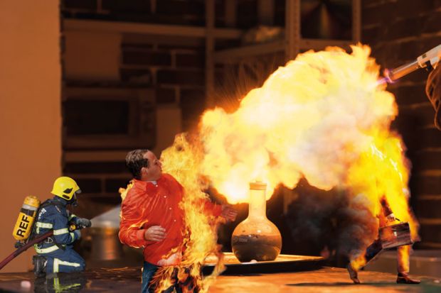 Lab technician setting fire to a ball with a hydrogen blowtorch to illustrate Can the REF really address the research environment crisis?