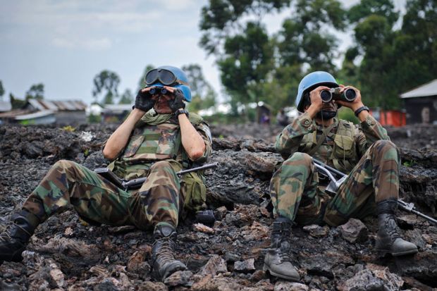 Uruguayan United Nations peacekeepers look through binoculars Uruguayan United Nations peacekeepers look through binoculars to illustrate New rules of engagement