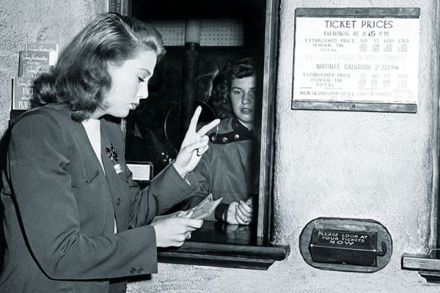 Woman buying two tickets Woman buying two tickets