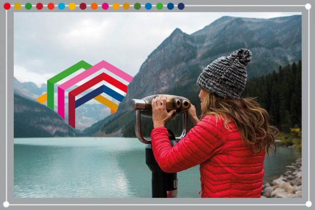 Woman looking through binoculars towards the Times Higher Education SDG icon embedded in the scenery, Canada. To illustrate assessing SDG engagement.